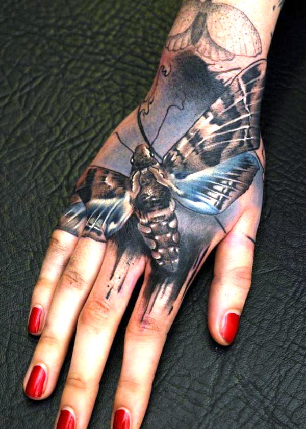 Realistic Moth Tattoo Hand