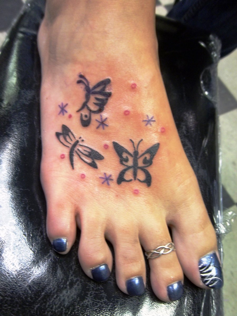 Tribal Butterfly Tattoo On Foot