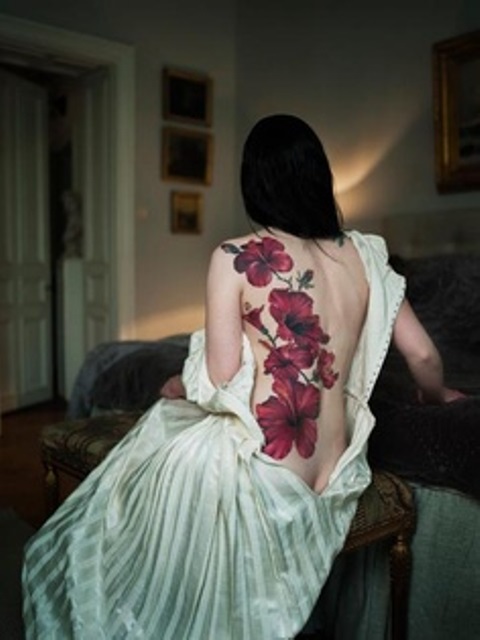 back-tattoo-design-for-women-elegant-red-flowers