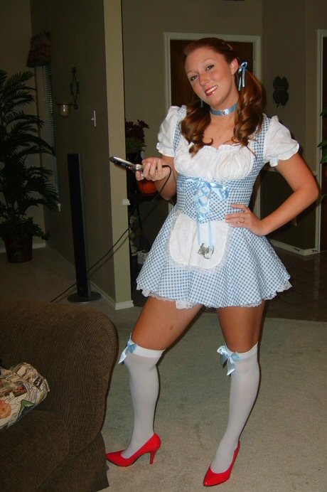 Cute-Student-Girl-in-Alice-in-Wonderland-Costume-at-Halloween-Party