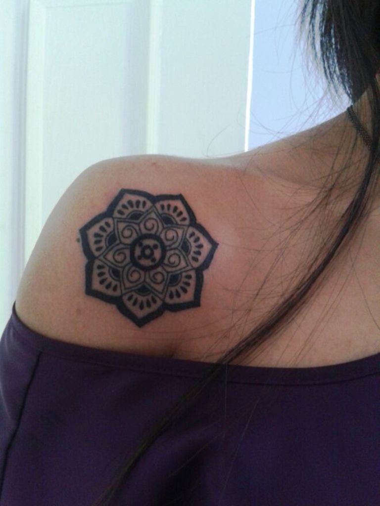 Lotus Flower and Strength Tattoo
