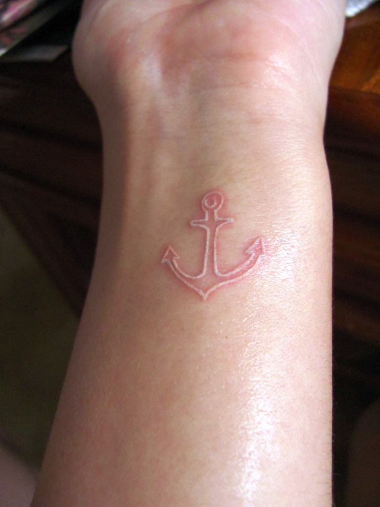Small White Ink Anchor Tattoo
