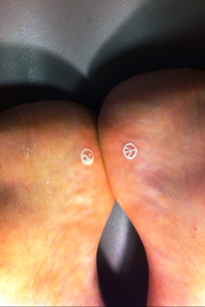 Small White Ink Foot Tattoos