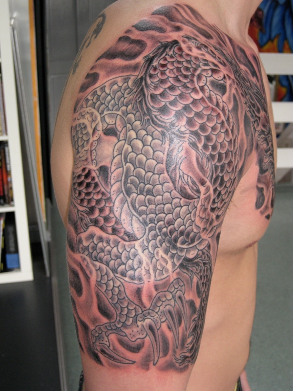 chest-and-upper-arm-dragon-tattoo