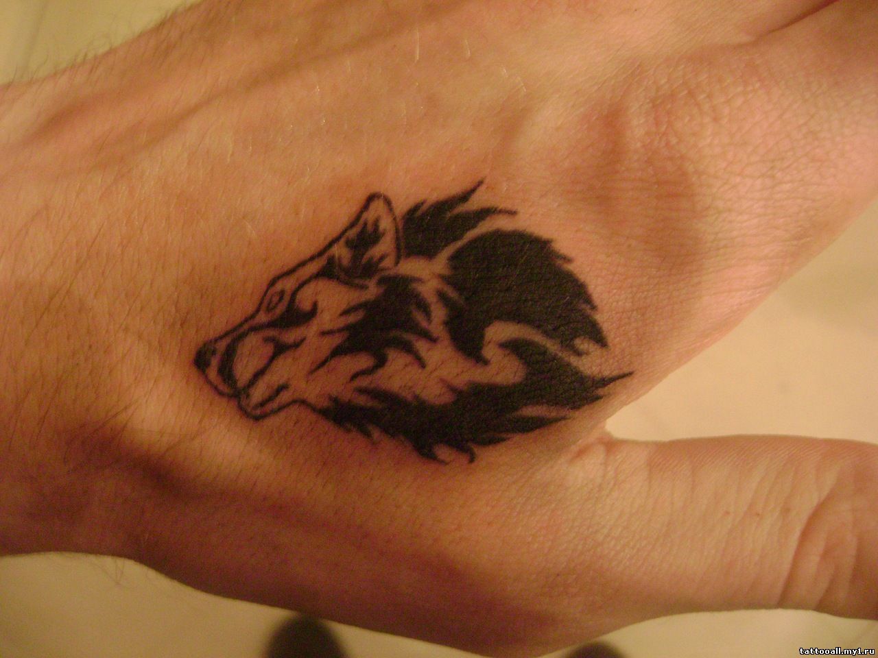 Small Wolf Tattoo On Hand - Flawssy
